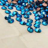 Cluster of cobalt blue faceted crystal rhinestones with rose-gold backs