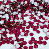 Preciosa crystal MAXIMA Rose, no hotfix flat back scattered pile of stones in Ruby red colour, dura foil backing showing in detail