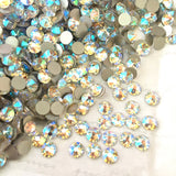 Swarovski Crystal article 2088 XIRIUS Rose, no hotfix stones scattered in colour Crystal Shimmer, an iridescent effect, platinum foil back visible, star facet design