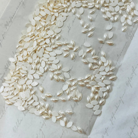 Swarovski hotfix navette crystals in crystal creampearl, oval cabochons in grouped piles
