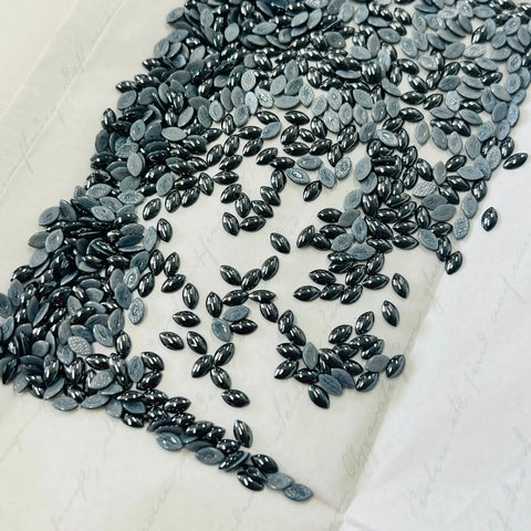 Jet hematite hotfix navette cabochon crystals, oval dark gray with metallic shine on backing