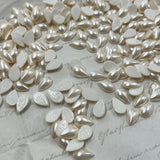Close-up of cream/white pearl-effect pear drop hotfix crystals