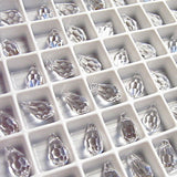 actual photo of tray of Article 6000 Swarovski Crystal teardrop pendants in clear crystal colour