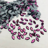 real photo of amethyst coloured hotfix crystals in Navette Marquise shape