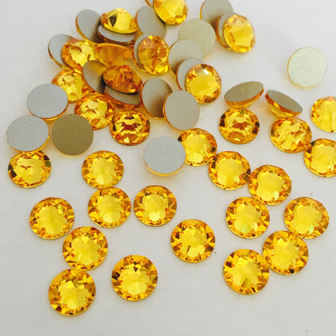 real photo from above of glue on XIRIUS Rose crystals in Sunflower colour
