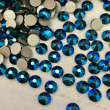 real photo of Swarovski No Hotfix XIRIUS Rose stones in Metallic blue a shiny dark blue faceted diamanté 