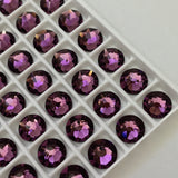 real photo of Crystals from Swarovski in their tray the colour is Amethyst