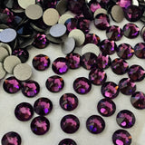 actual photo of scattered Swarovski flat back crystals in the colour Amethyst