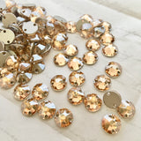 actual photo of Swarovski Crystal round sew-on stones in Golden Shadow colour effect