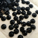 close up photo of Article 3288 Swarovski Crystal XIRIUS Sew-on flat back round stones in black colour