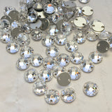 real photo of Swarovski Crystal Article 3288 XIRIUS sew-on stones round with flat back in clear colour