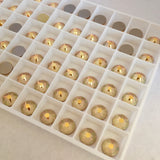 gold crystals photographed in the tray the colour is crystal metallic sunshine from Swarovski Elements