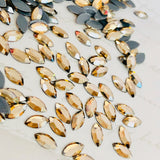 real photo of Swarovski Crystal Hotfix crystals Navette shape in Golden Shadow
