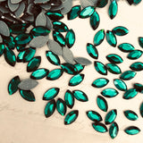 real photo of Swarovski Crystal article 2200 Navette Flat Back in emerald green