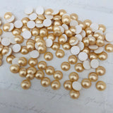real photo showing Swarovski Crystal pearls in Vintage Gold colour